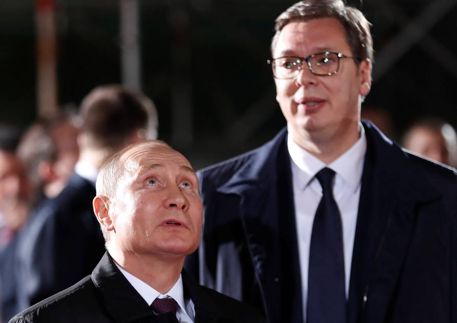 Russian President Vladimir Putin looks up next to Serbian President Aleksandar Vucic in St Sava temple in Belgrade