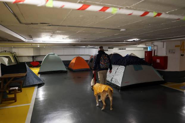 Israelis hold a Passover Seder in an underground parking garage used as a public bomb shelter, in Tel Aviv