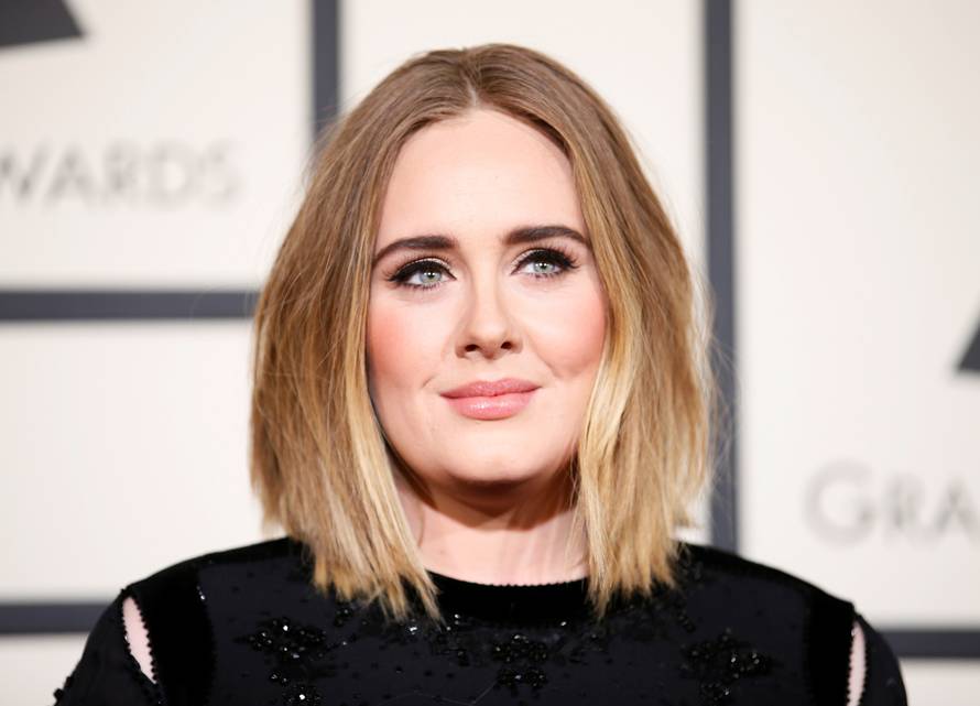FILE PHOTO: Adele arrives at the 58th Grammy Awards in Los Angeles
