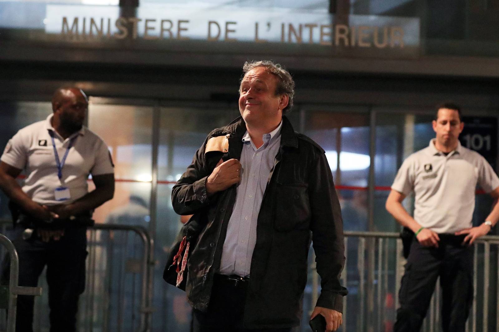 Former head of European football association UEFA Michel Platini leaves a judicial police station where he was detained for questioning over the awarding of the 2022 World Cup soccer tournament, in Nanterre