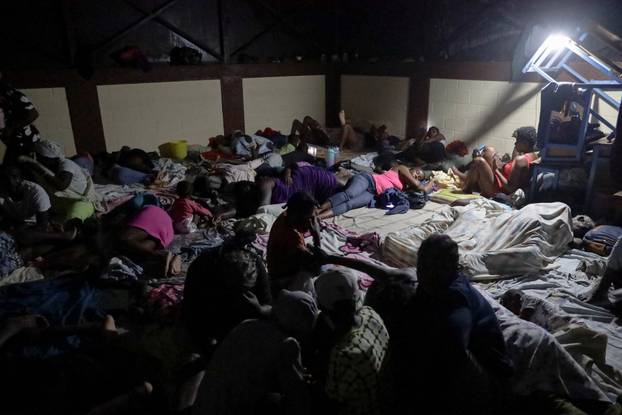 People evacuate as rains of Hurricane Melissa batter Les Cayes