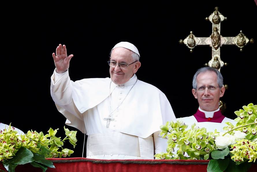 Pope Francis appears after delivering his Easter message in the Urbi et Orbi (to the city and the world) address from the balcony overlooking St. Peter's Square at the Vatican