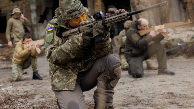 Alisa, a media relations specialist, takes part in a combat skills training conducted by the Territorial Defense Forces near Kyiv