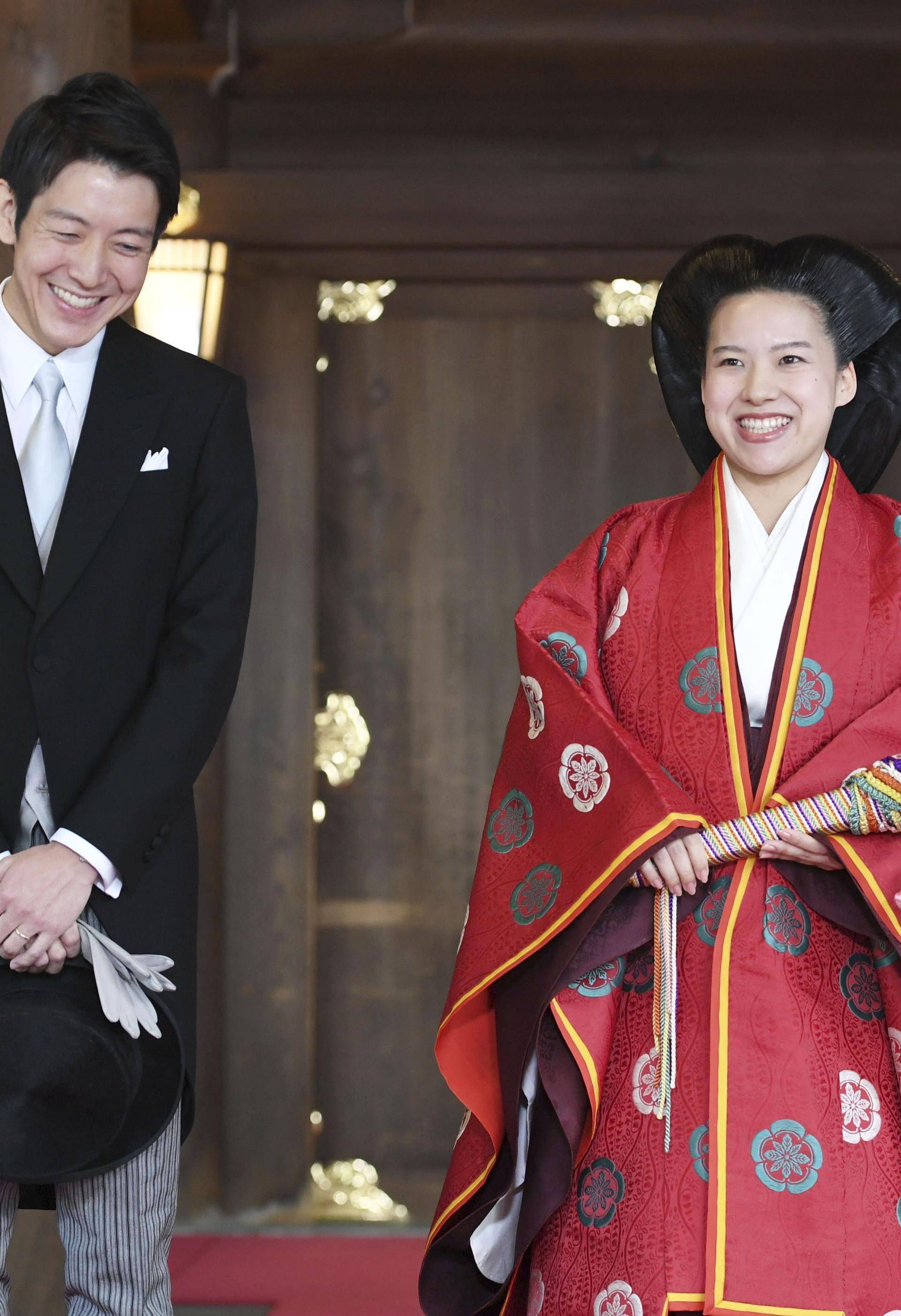 Japanese Princess Ayako and her husband Kei Moriya answer reporters' questions after their wedding ceremony at the Meiji Shrine in Tokyo