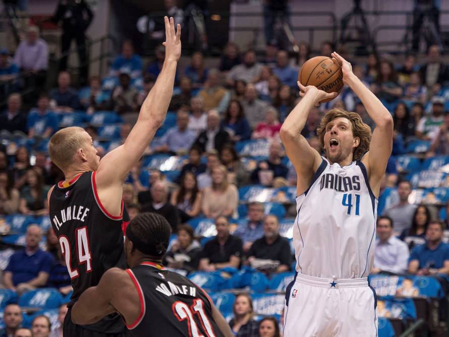 File Photo: Dallas Mavericks forward Dirk Nowitzki shoots the ball over Portland Trail Blazers center Mason Plumlee during the first quarter in Dallas