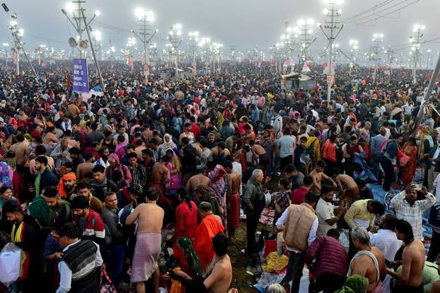Devotees take a dip at Sangam during "Maha Kumbh Mela" in Prayagraj