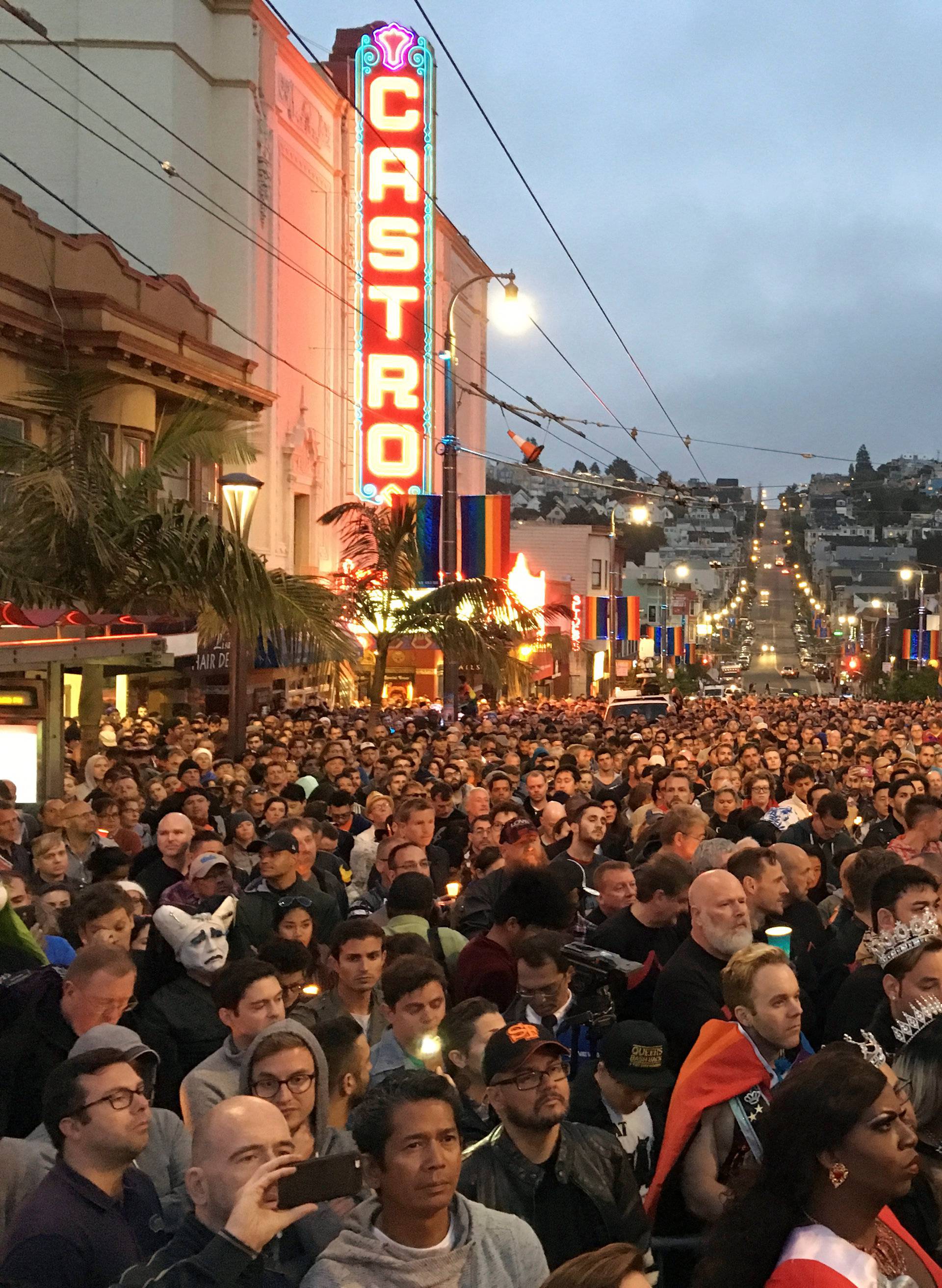 People gather in the Castro District for a vigil for the victims of the Orlando shooting at a gay nightclub, in San Francisco