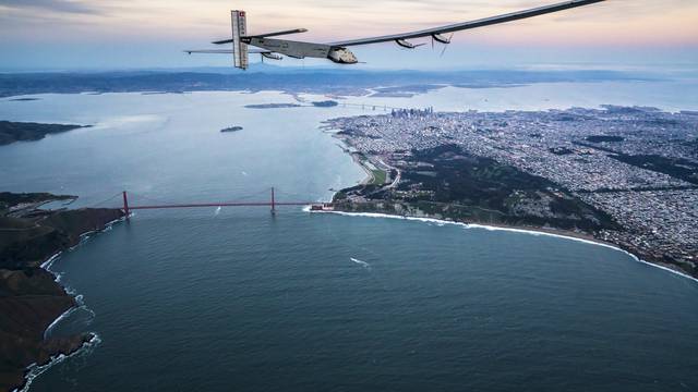 "Solar Impulse 2", a solar-powered plane piloted by Bertrand Piccard of Switzerland, flies over the Golden Gate bridge in San Francisco