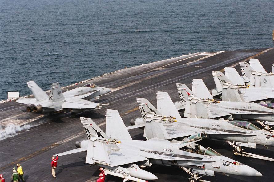 An F/A-18C Hornet assigned to Strike Fighter Squadron 113 (VFA-113) launches from USS Abraham Lincoln (CVN 72) flight deck. Lincoln and Carrier Air Wing Fourteen (CVW-14) conduct combat operations supporting Operation Southern Watch.