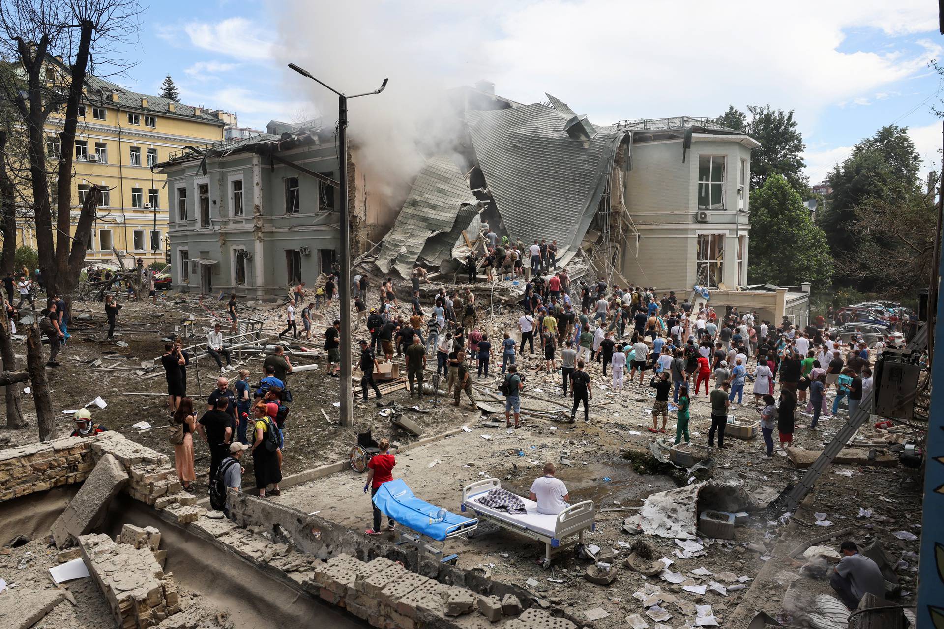 Rescuers work at Ohmatdyt Children's Hospital that was damaged during a Russian missile strikes, in Kyiv