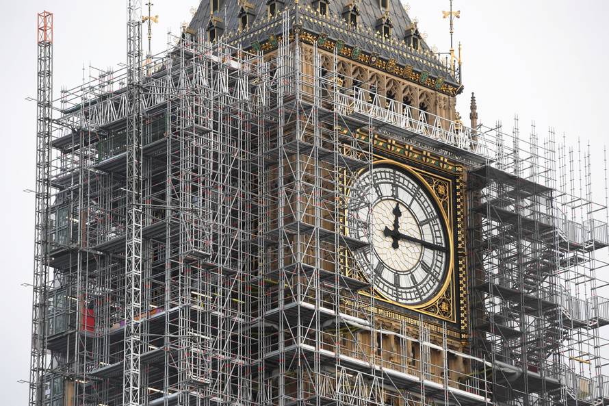 FILE PHOTO: The Elizabeth Tower, housing the Big Ben bell, is seen clad in scalffolding, over the Houses of Parliament, in central London