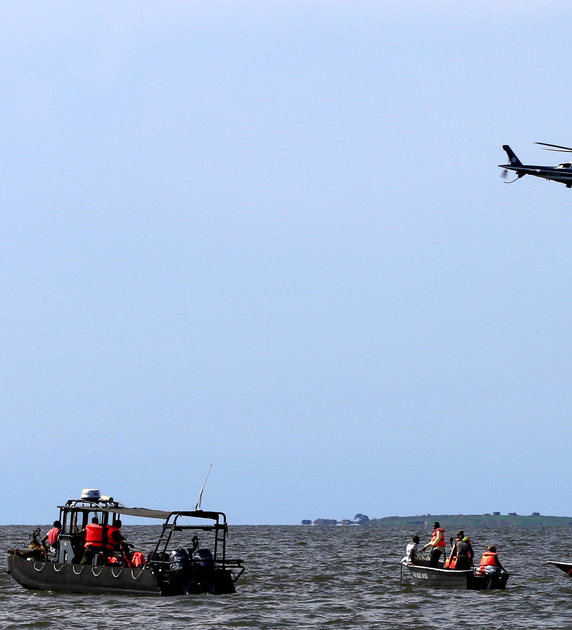 Rescue and recovery missions search for the bodies of dead passengers after a cruise boat capsized in Lake Victoria off Mukono district