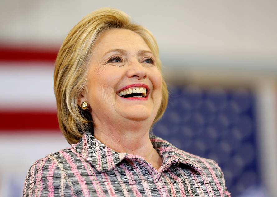 U.S. Democratic presidential candidate Hillary Clinton smiles on stage as she makes a campaign stop in Sacramento, California