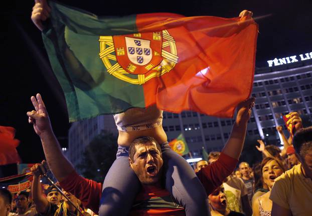 Fans of Portugal react after the Euro 2016 final between Portugal and France in Lisbon