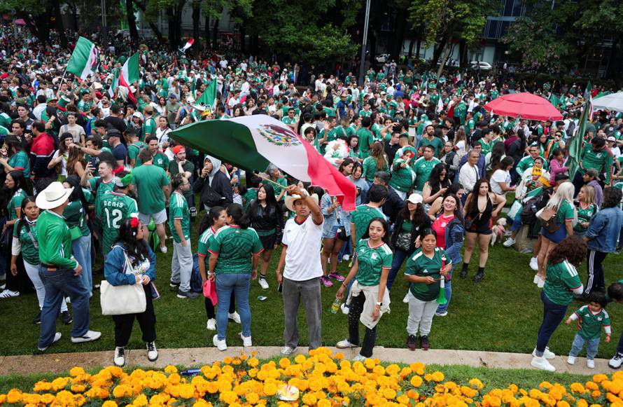 People celebrate Mexico's victory in the opening match of the 2026 FIFA World Cup, in Mexico City