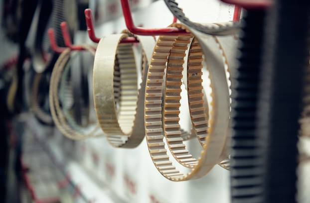 A,Rack,Of,Industrial,Machine,Drive,Bets,Hanging,In,An