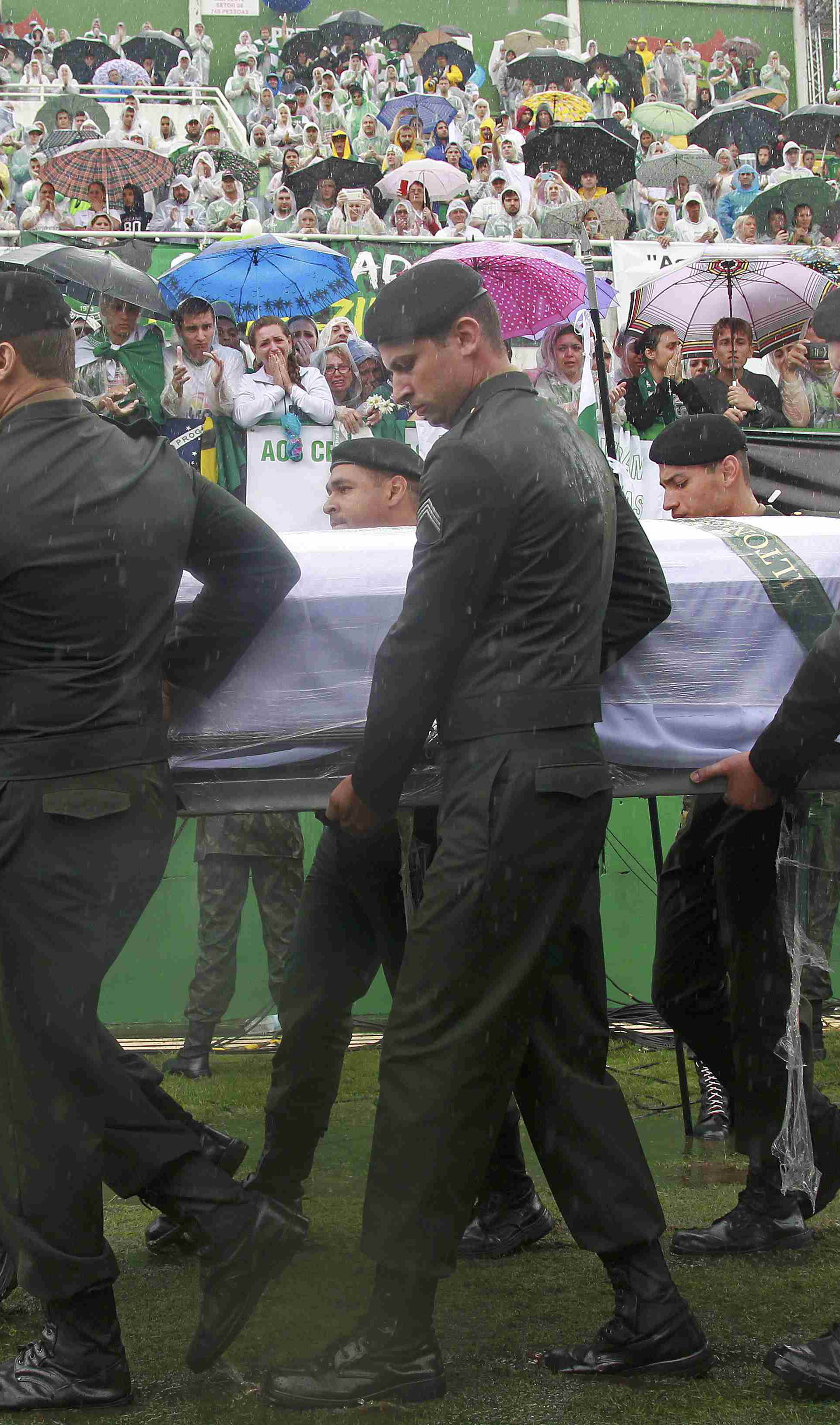 The coffin of one of the victims of the plane crash in Colombia arrives at the Arena Conda stadium in Chapeco