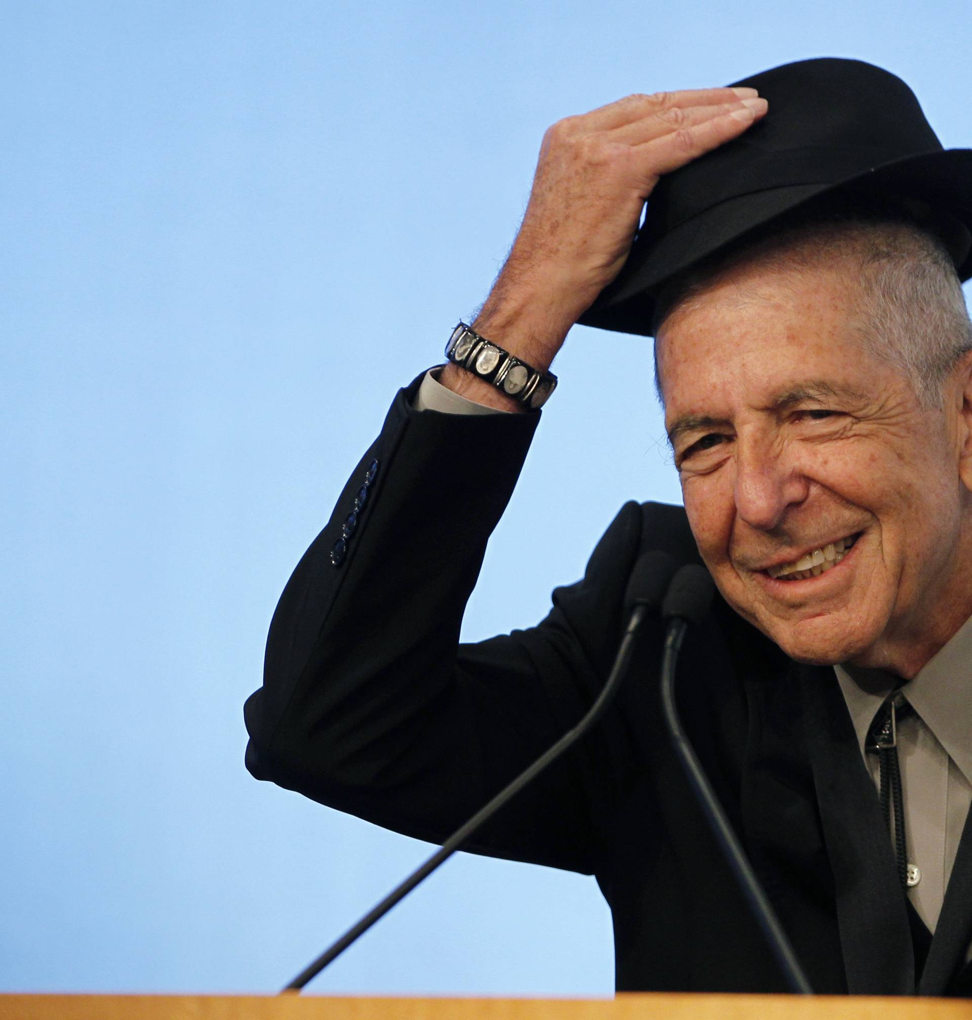 Cohen tips his hat as he accepts the 2012 Awards for Song Lyrics of Literary Excellence in Boston