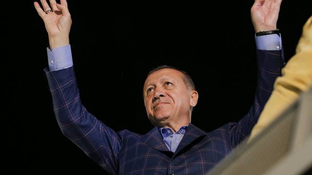 Turkish President Tayyip Erdogan greets his supporters in Istanbul
