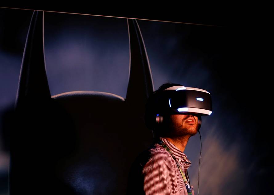 People try the new Sony VR headset during Sony Corporation's PlayStation 4 E3 2016 event in Los Angeles