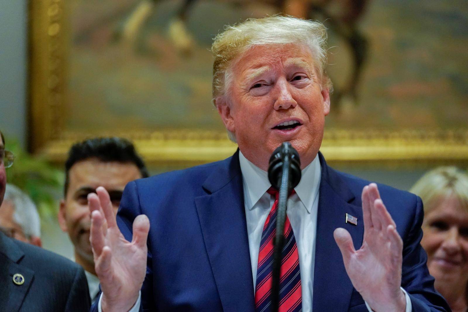 U.S. President Trump responds to questions from reporters at the White House in Washington