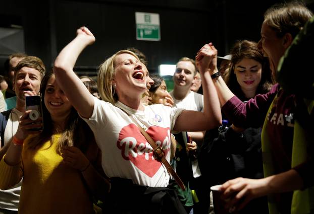 Activists react at the count centre as votes are tallied folowing yesterday
