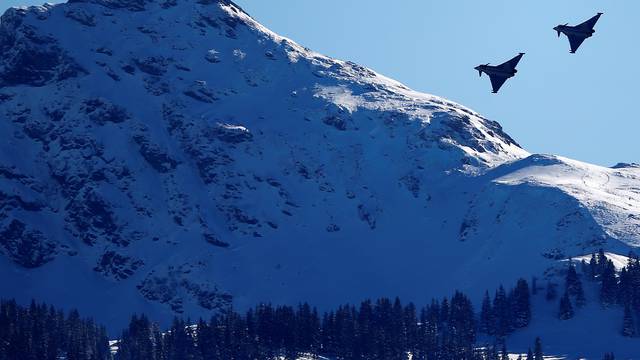 FILE PHOTO: Two Eurofighter Typhoon aircraft fly over the Streif course during an aerial exhibition before the start of the men's Alpine Skiing World Cup Super G race in Kitzbuehel