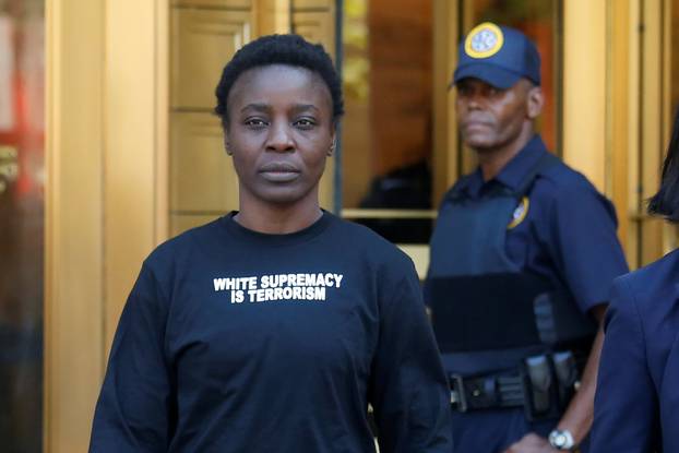 Patricia Okoumou walks out of federal court from her arraignment, a day after authorities say she scaled the stone pedestal of the Statue of Liberty to protest U.S. immigration policy, in Manhattan, New York