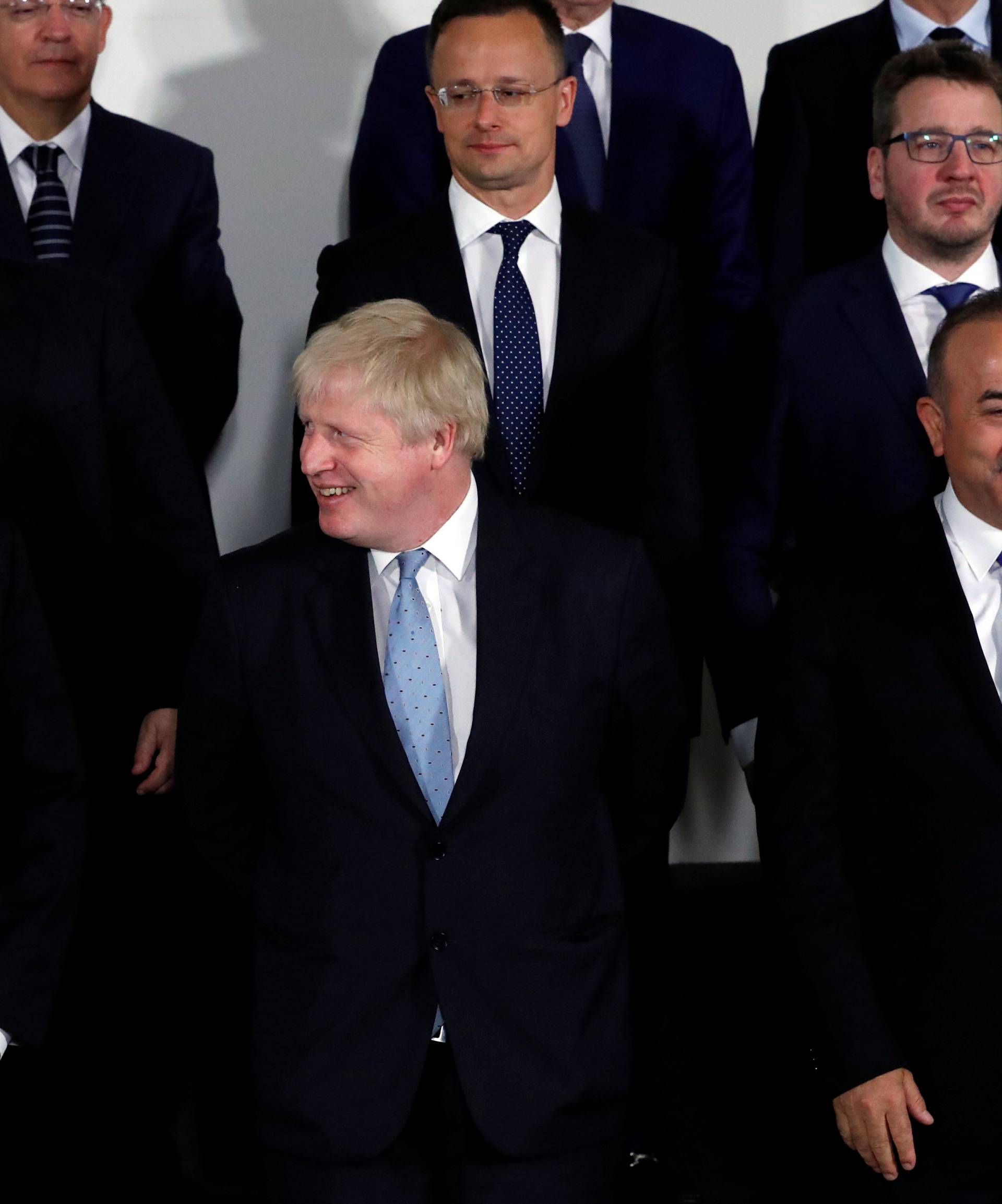 U.S. Secretary of State Pompeo, Britain's Foreign Secretary Johnson and Turkish Foreign Minister Cavusoglu pose for a group photo at a NATO foreign ministers meeting at the Alliance's headquarters in Brussels