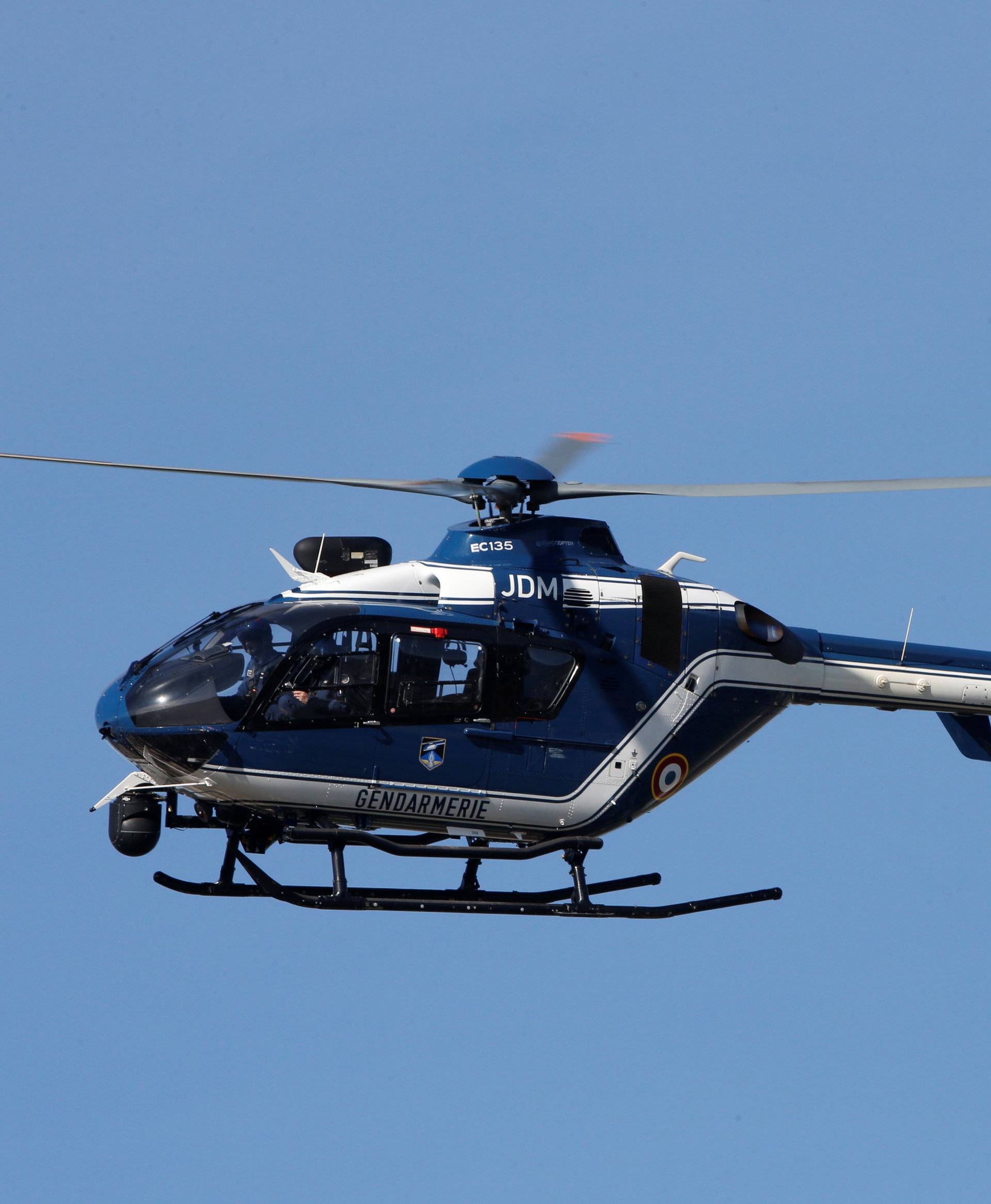 A gendarmerie helicopter flies over the village of Trebes after a hostage situation in a supermarket