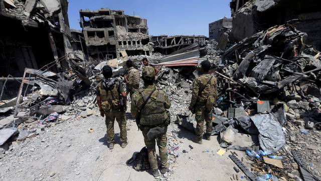 Members of the Emergency Response Division are seen in the Old City of Mosul