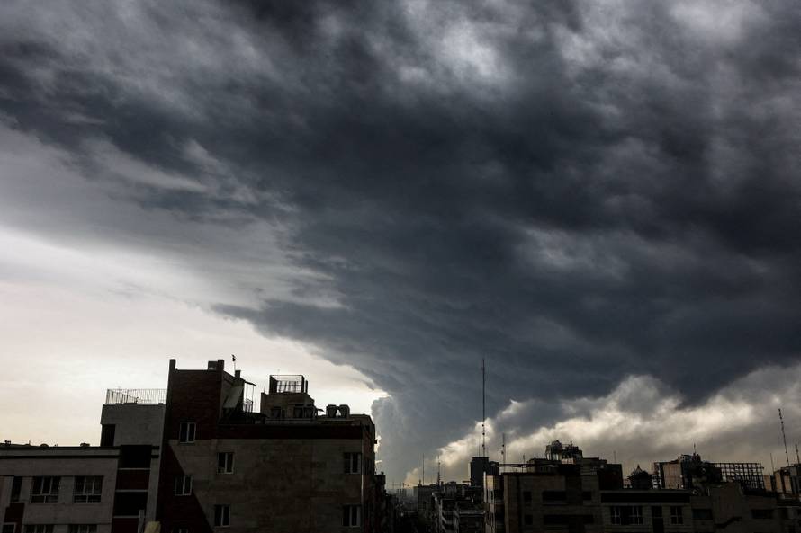 Smoke continues to rise after a reported strike on fuel tanks in an oil refinery, amid the U.S.-Israeli conflict with Iran, in Tehran
