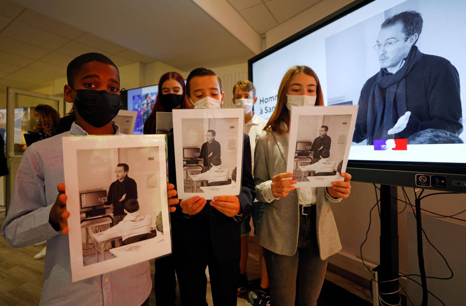 Schoolchildren and teachers pay homage to French teacher Samuel Paty in France