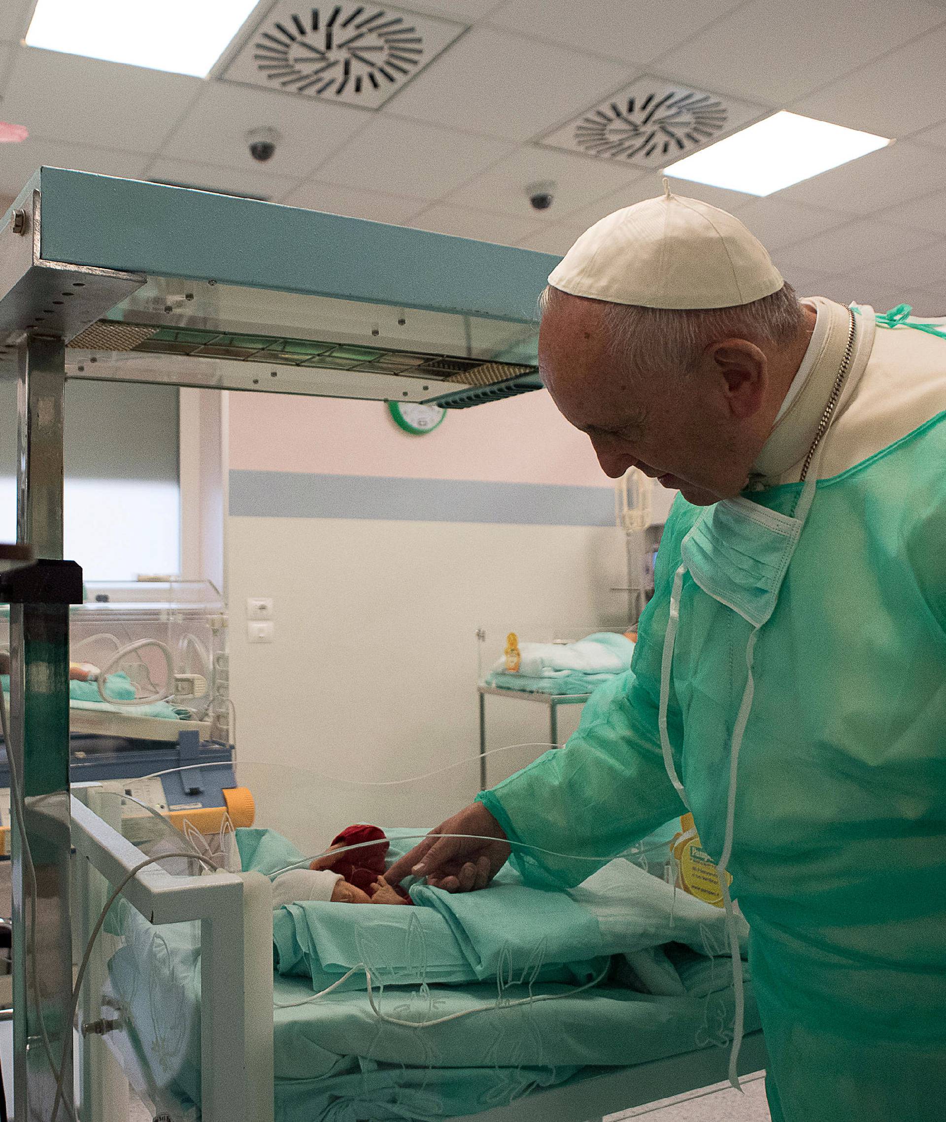 Pope Francis visits the intensive care nursery at the San Giovanni hospital in Rome