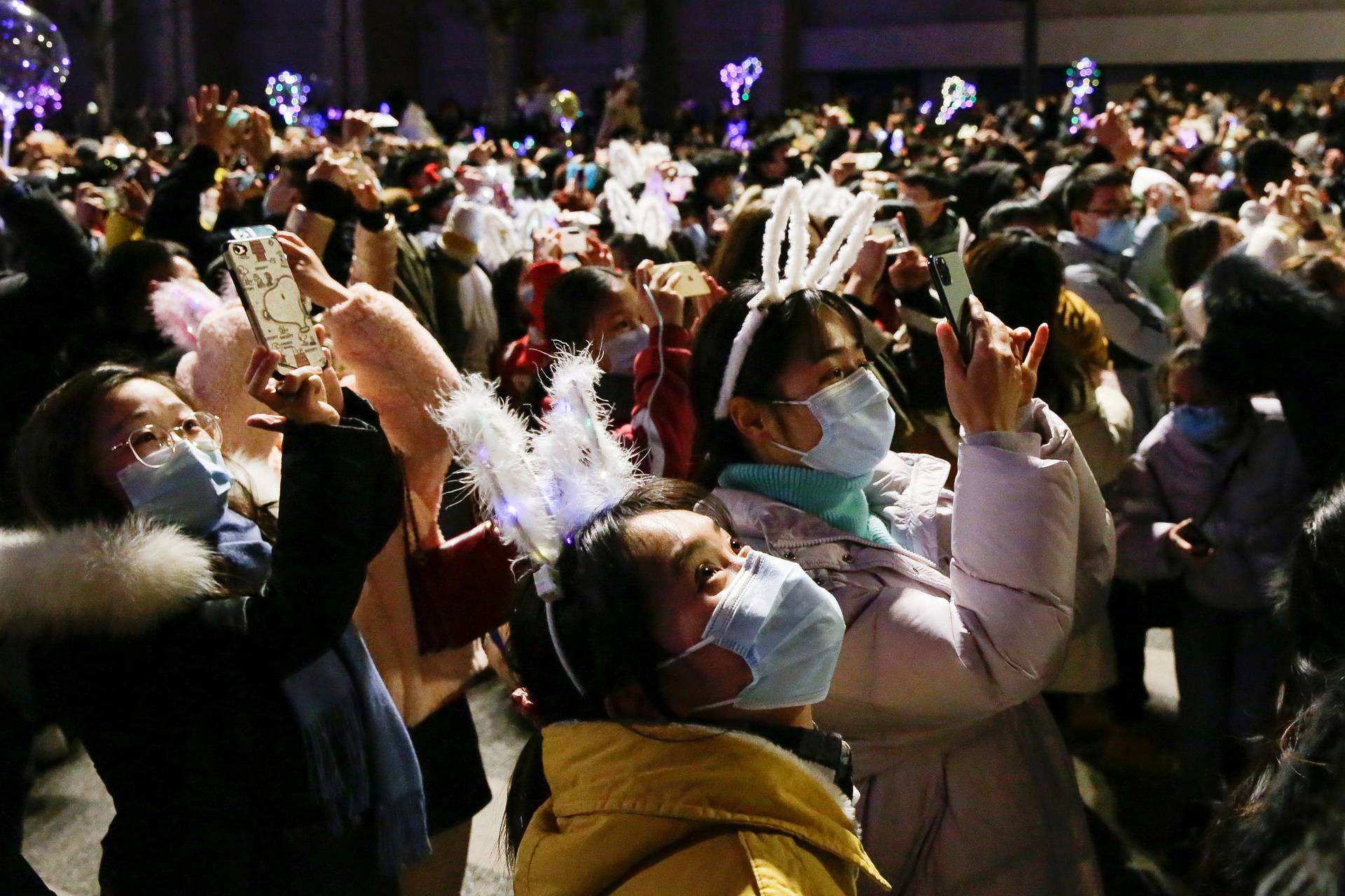 People celebrate the arrival of the new year in Wuhan