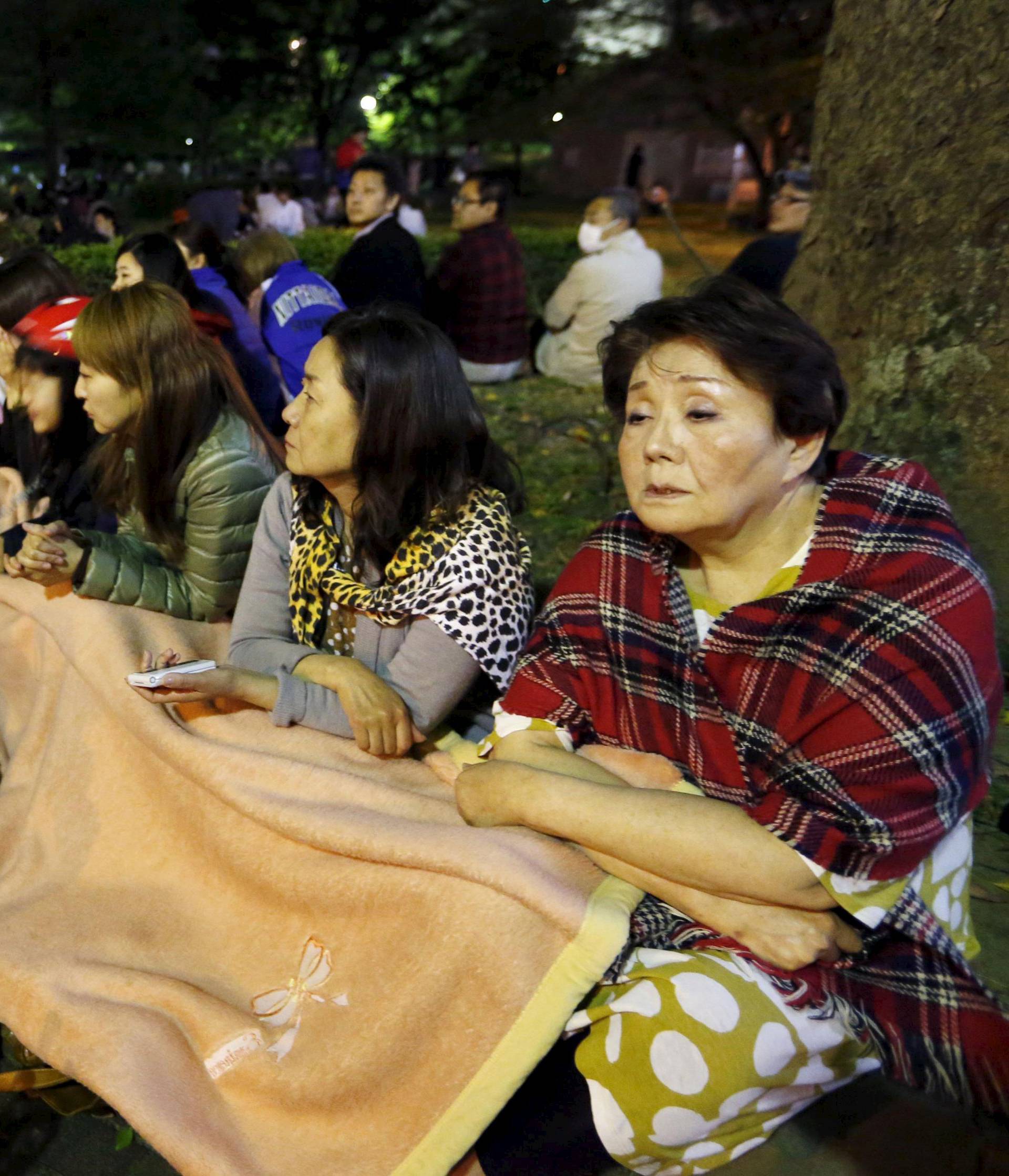 Evacuated residents gather at Shirakawa park after an earthquake in Kumamoto, southern Japan