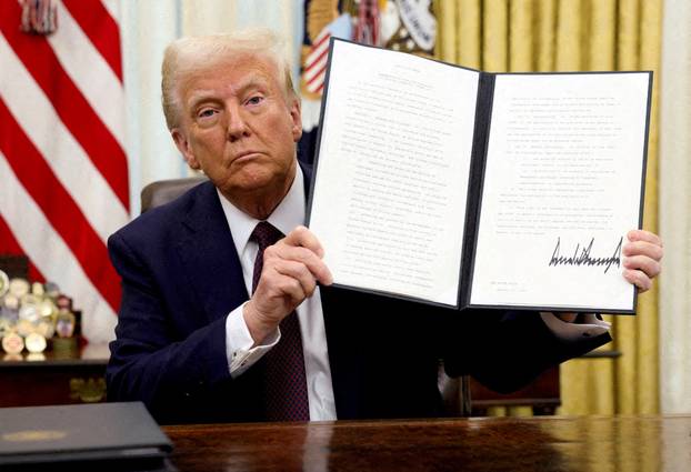 File Photo: US President Trump Signs An Executive Order in the oval Office, at the White House