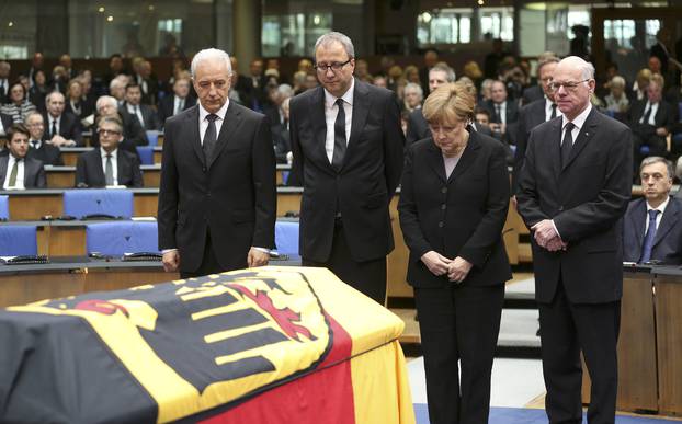 German officials pay respects during a memorial service for former West German foreign minister Genscher in the former lower house of parliament Bundestag in Bonn