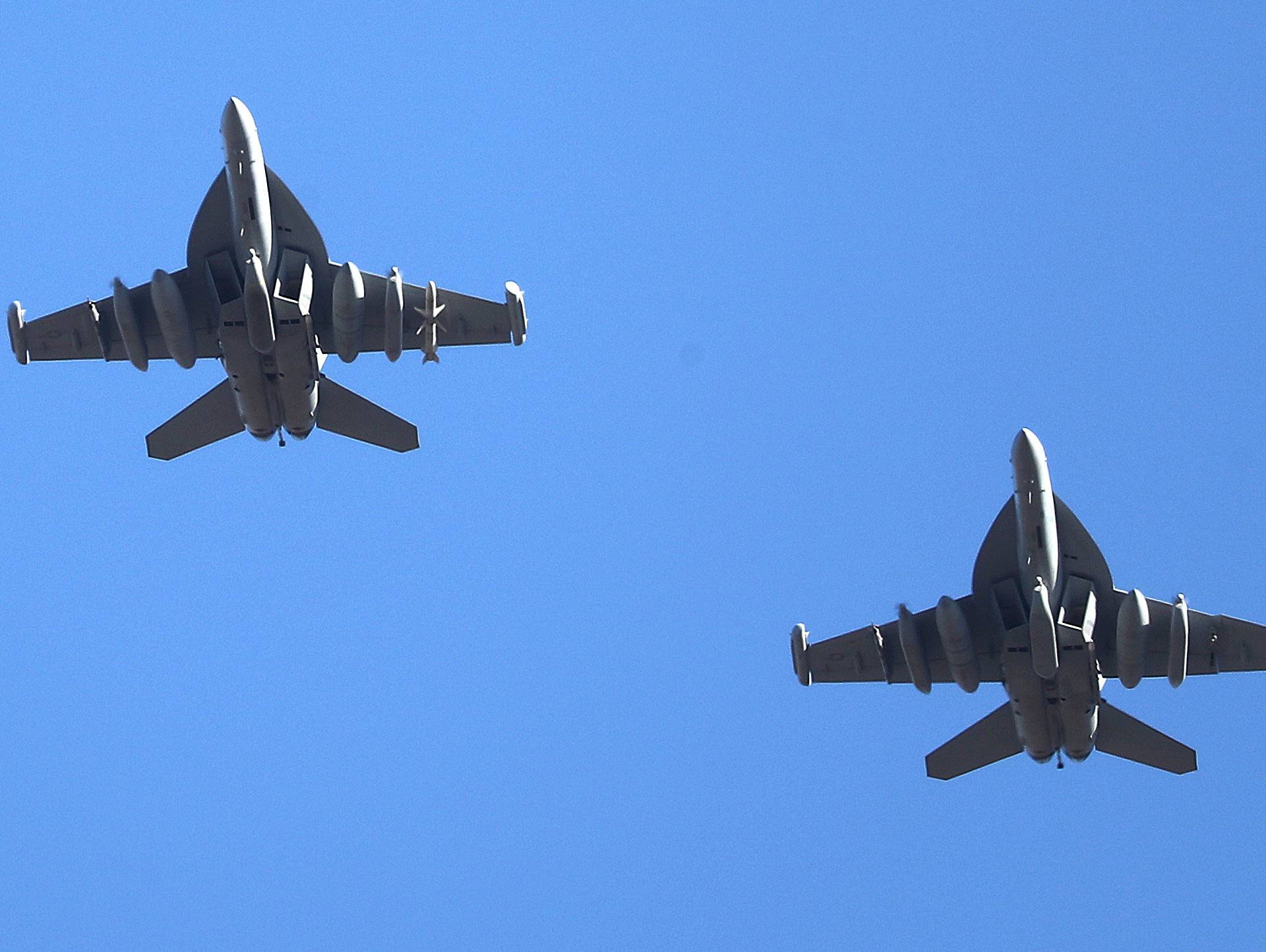 U.S. Air Force EA-18G Growler fighter jets fly over the Osan Air Base in Pyeongtaek