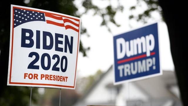 Yard signs supporting Democratic U.S. presidential nominee and former Vice President Joe Biden and against U.S President Donald Trump are seen outside of a house in Lancaster