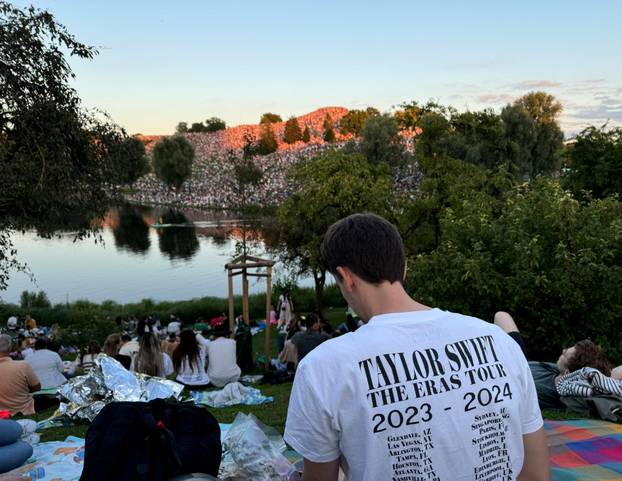 Thousands of Taylor Swift fans gather near concert venue to listen to her performance