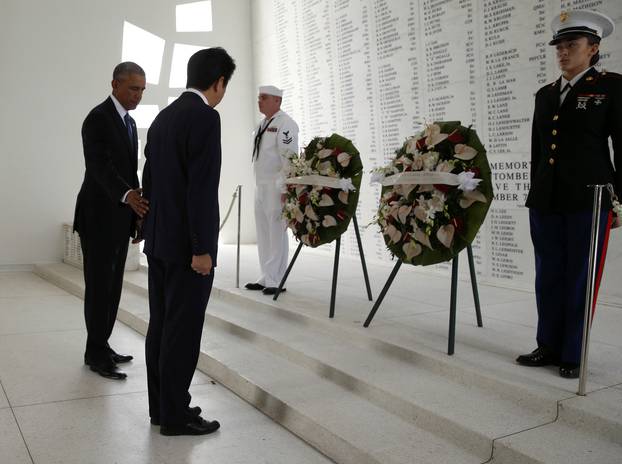 U.S. President Obama and Japanese Prime Minister Abe participate in wreath-laying ceremony aboard USS Arizona Memorial at Pearl Harbor