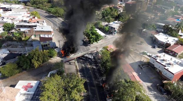 Smoke billows, following a military operation in which a government source said Mexican drug lord Nemesio Oseguera, known as "El Mencho," was killed, in Puerto Vallarta
