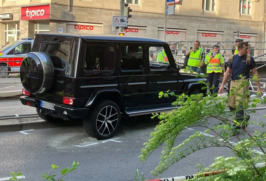 Car drives into group of people
