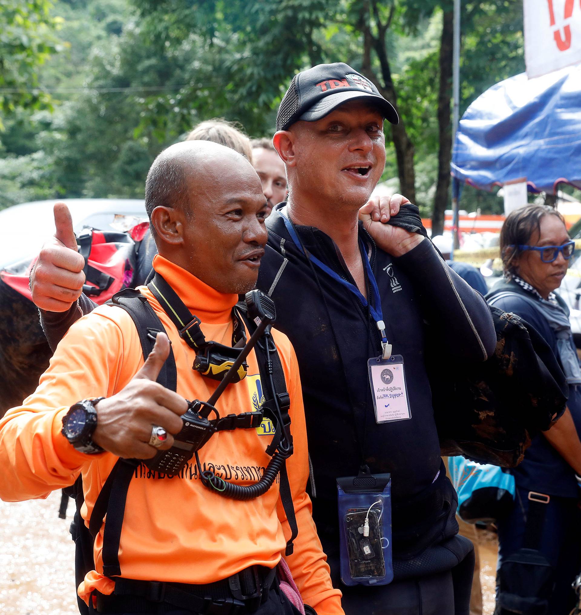 Foreign divers and Thailand divers celebrate as they came out from the Tham Luang cave complex, as members of under-16 soccer team and their coach have been found alive according to a local media's report, in the northern province of Chiang Rai