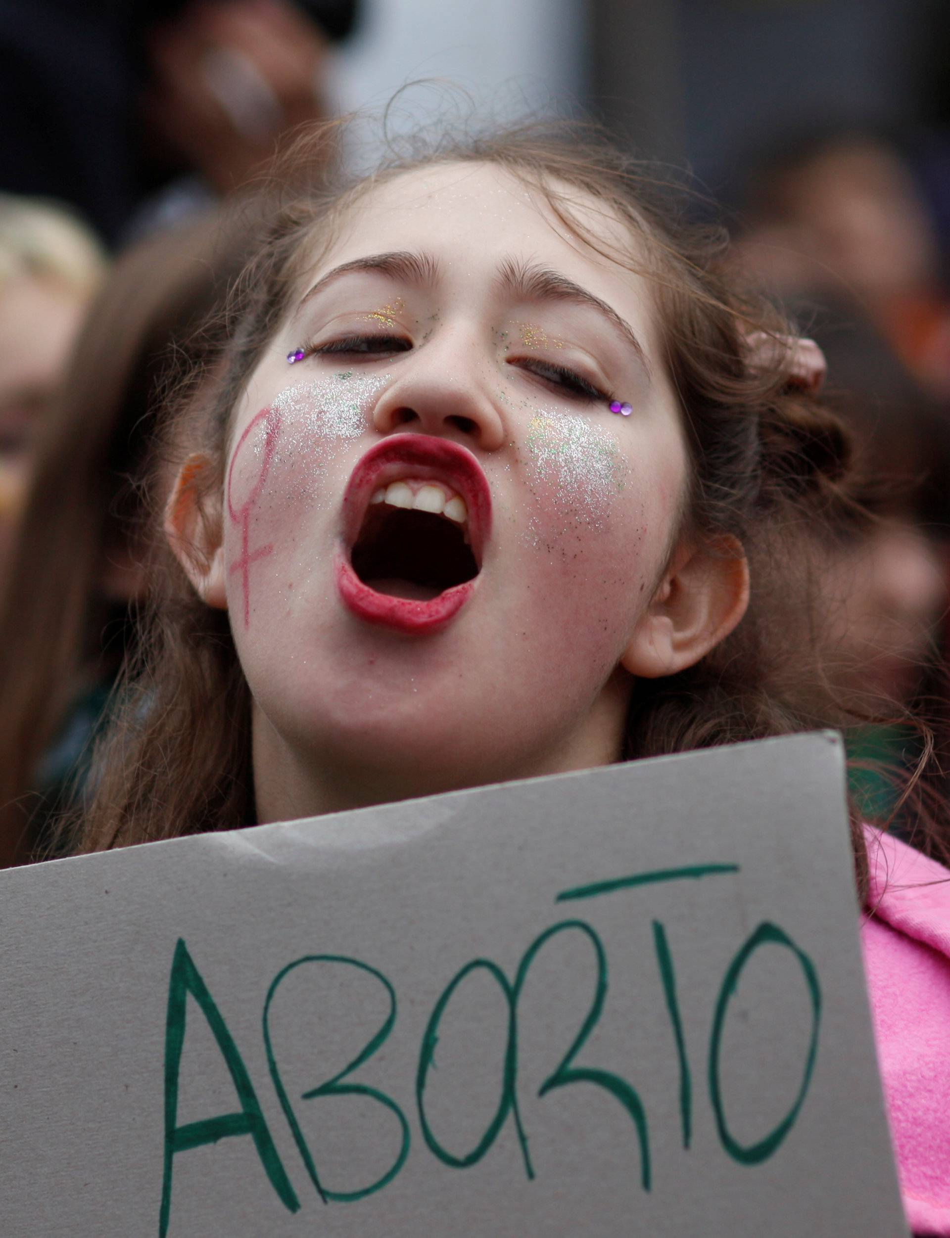 A demonstrator attends a protest in favour of legalising abortion outside the Congress while lawmakers debate an abortion bill in Buenos Aires