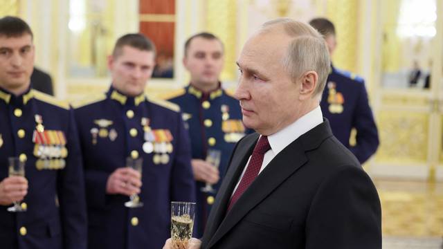 Russian President Vladimir Putin attends a ceremony to award Gold Star medals to Heroes of Russia, in Moscow