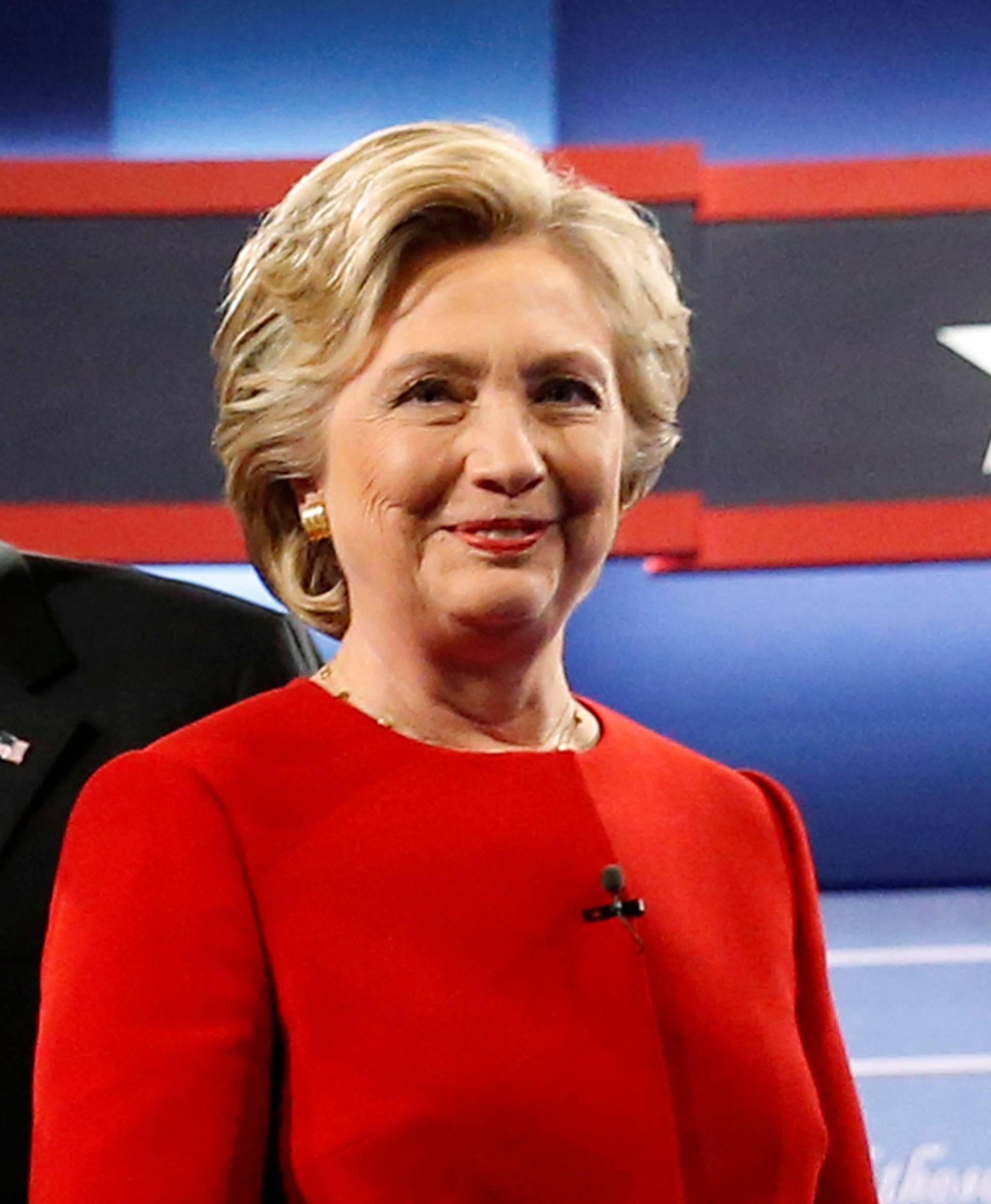 Trump and Clinton greet one another as they take the stage for their first debate at Hofstra University in Hempstead, New York, U.S.