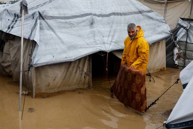 Displaced Palestinians shelter in a tent camp in Nuseirat
