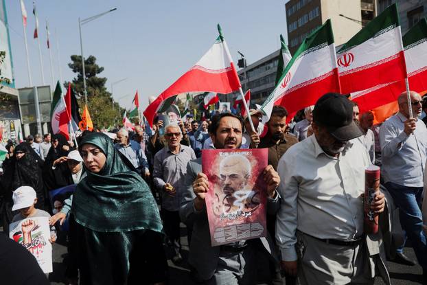 People attend a rally in support of the people of Gaza, after Friday prayers in Tehran